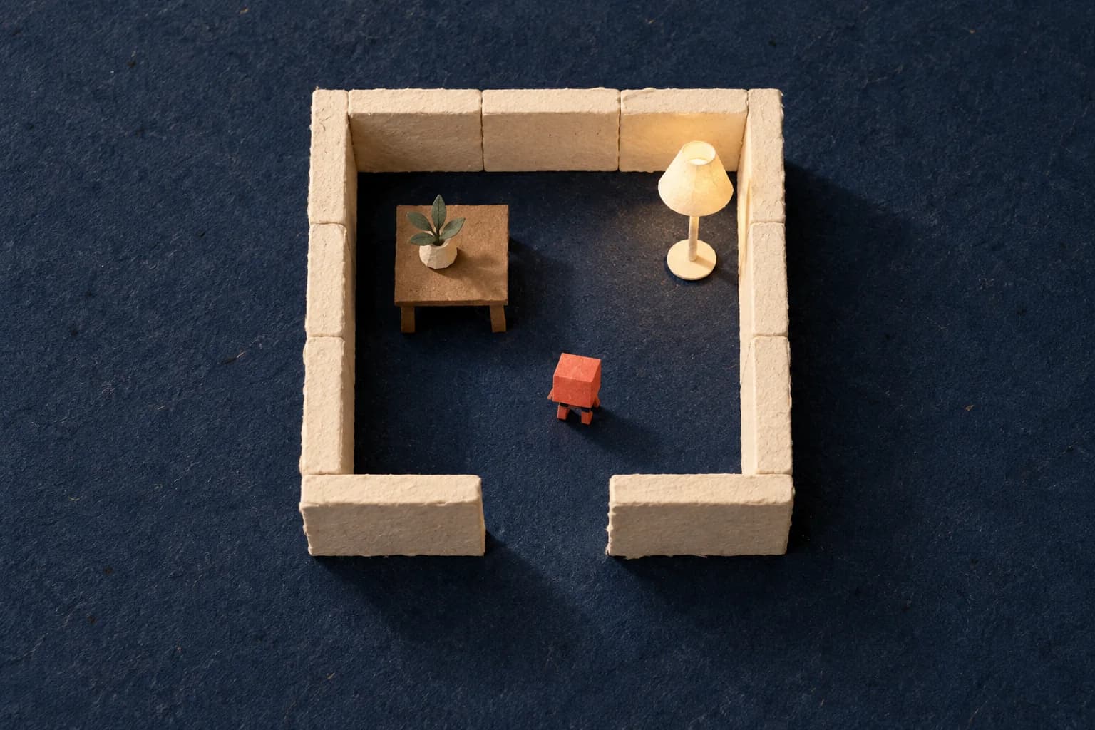 A simple paper room with cream walls, a clear doorway, a lamp and a small coral traveler